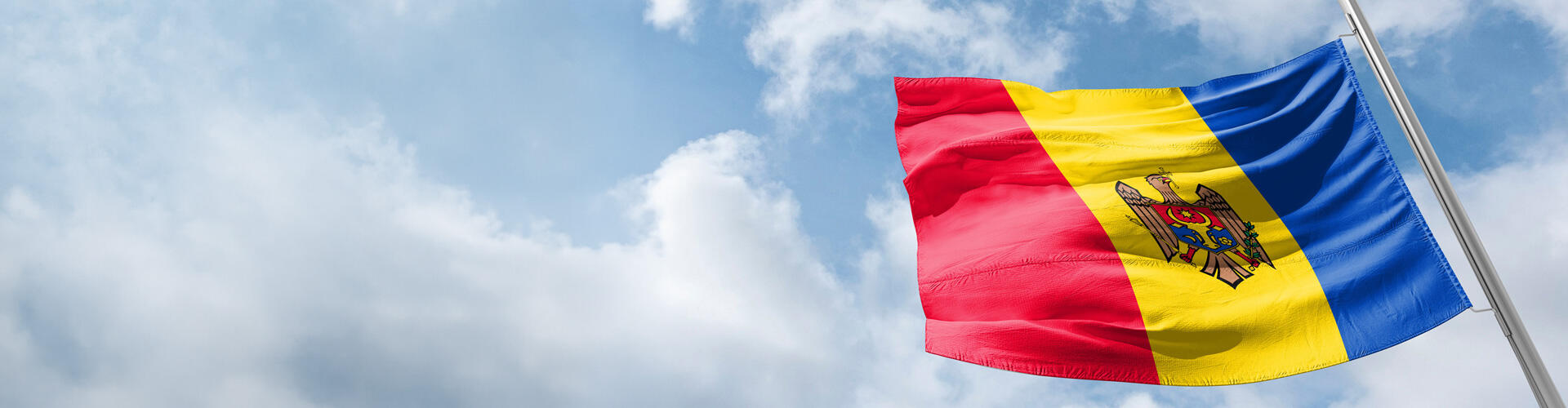Republic of Moldova flag with blue sky