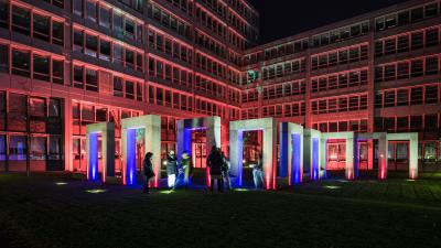 Visitors are amazed by an outside art installation at the Munich European Patent Office.